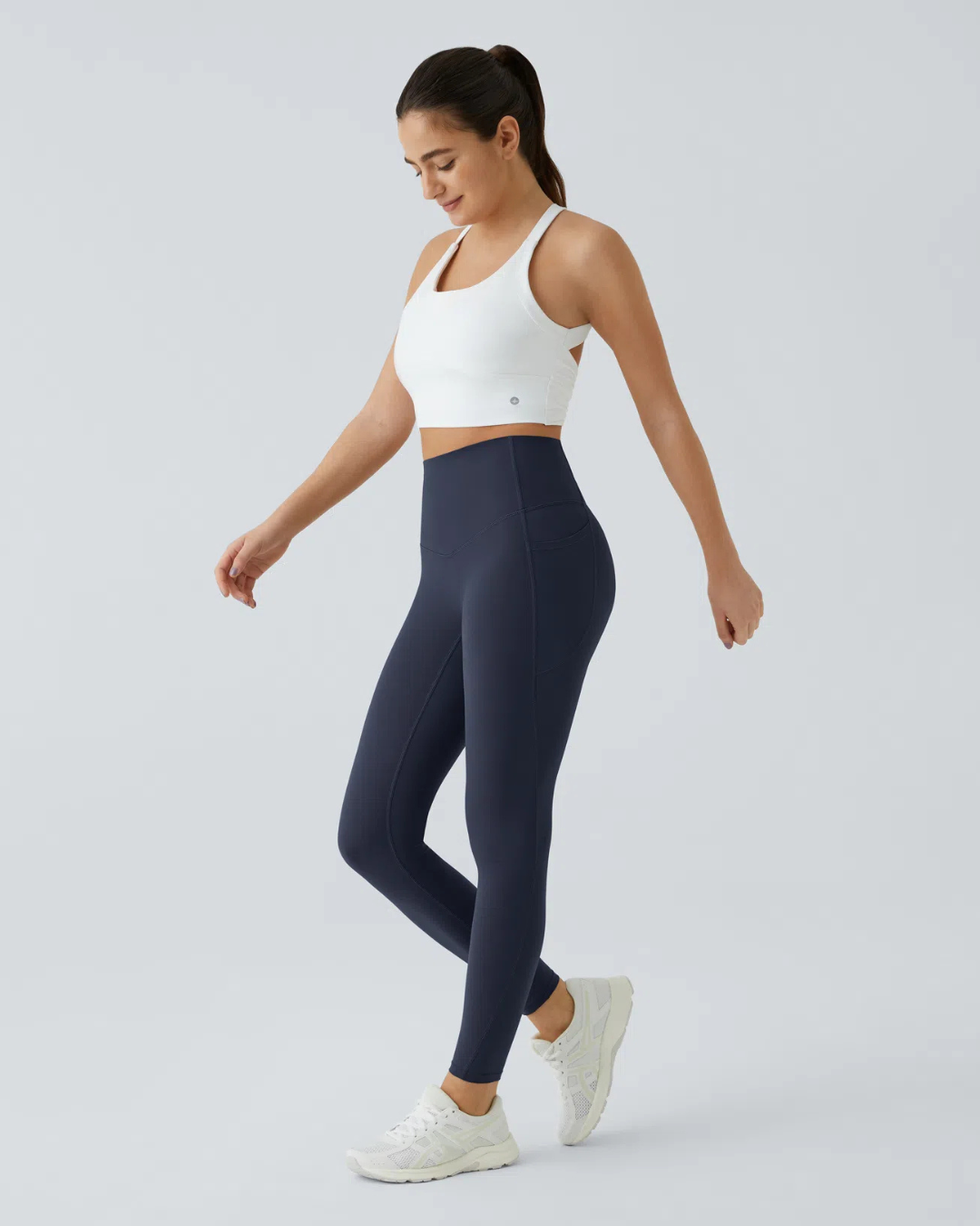 Legging modeladora com cintura alta, controle abdominal e bolsos laterais para treino